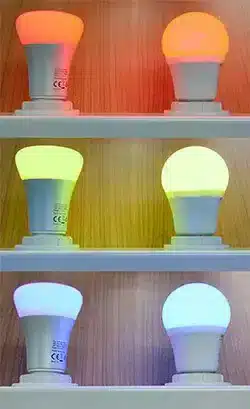 Side-by-side comparison of Philips and Osram LED spotlights in a modern showroom.