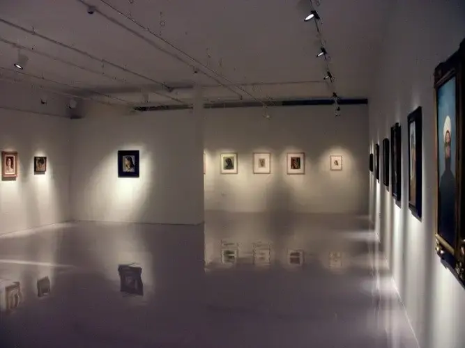 Modern art gallery illuminated with directional spotlights