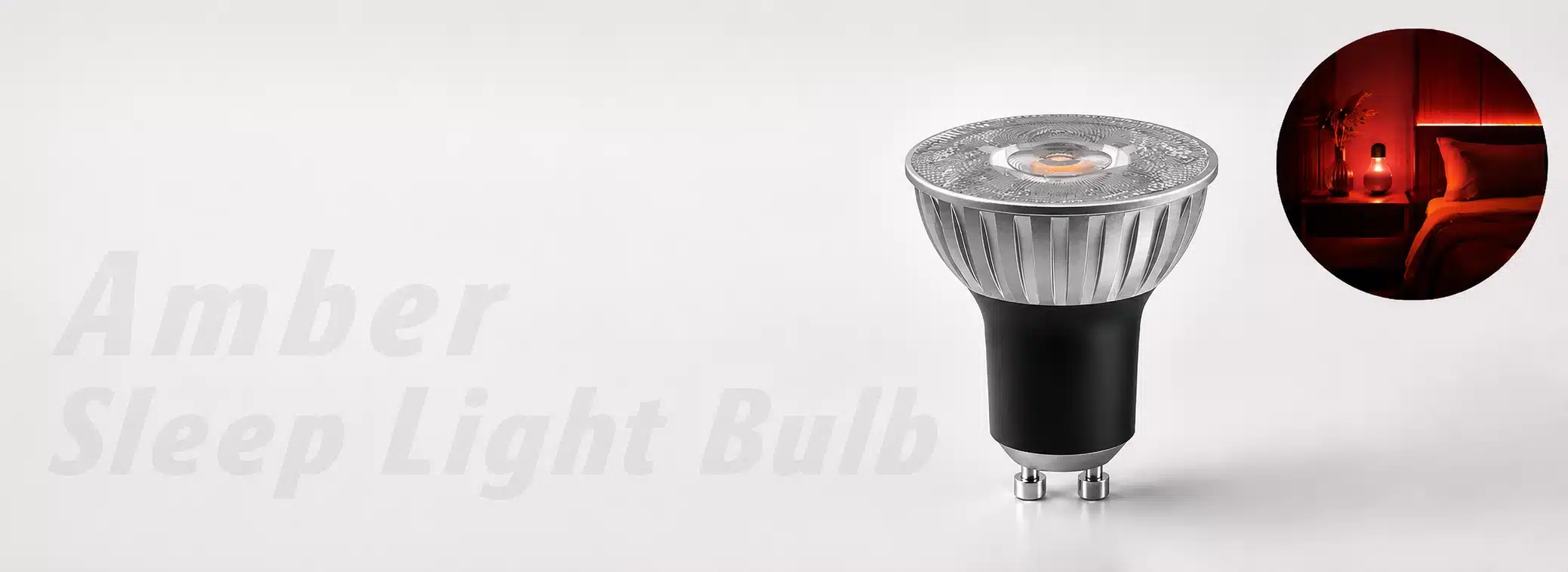 Close-up of a silver and black LED bulb with amber glow, featuring a bedroom inset showing warm red ambient lighting.